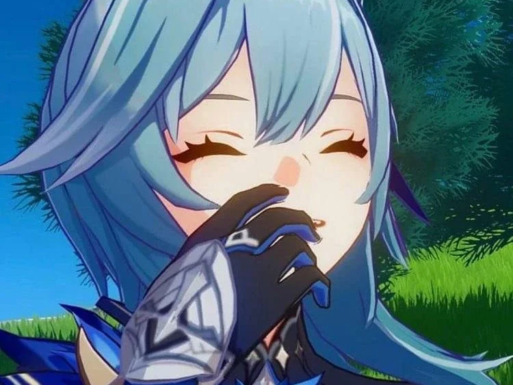 Eula laughing with her eyes closed and covering her mouth with her hand.